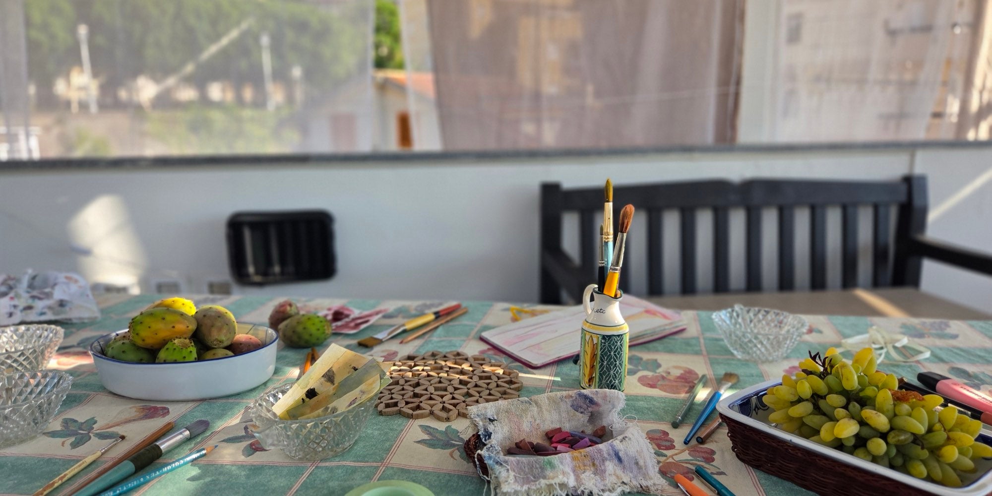 Art materials on the terrace table overlooking Bagnara