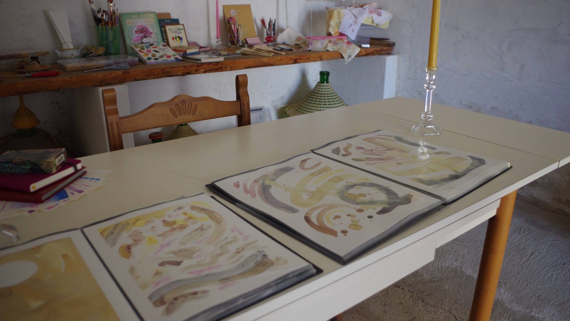 Watercolour studies laid out on the studio table